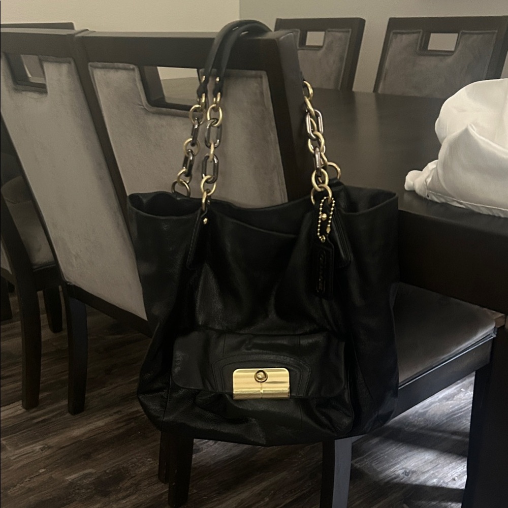 Elegant Black Leather Shoulder Bag with Gold Details
